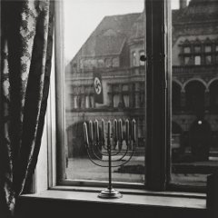 A menorah defies the Nazi flag 1931