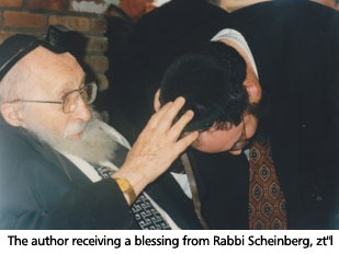 The author receiving a blessing from Rabbi Scheinberg