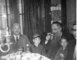 From L to R: JA Samuels, Rabbi Chaim Mordechai (Motel) Katz, the Telzer Rosh HaYeshiva, his son Yankel Velvel Katz, his Daughter Rochel Katz Tress, and the author’s father, Gershon Adler (obscured)