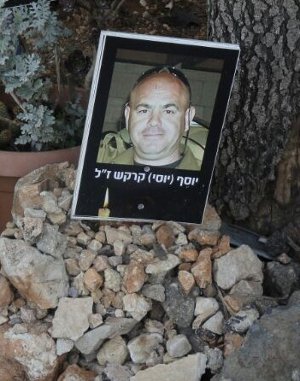 Yosi's picture at a memorial to the 12 soldiers outside of the Tel Hai cemetery where they were killed.